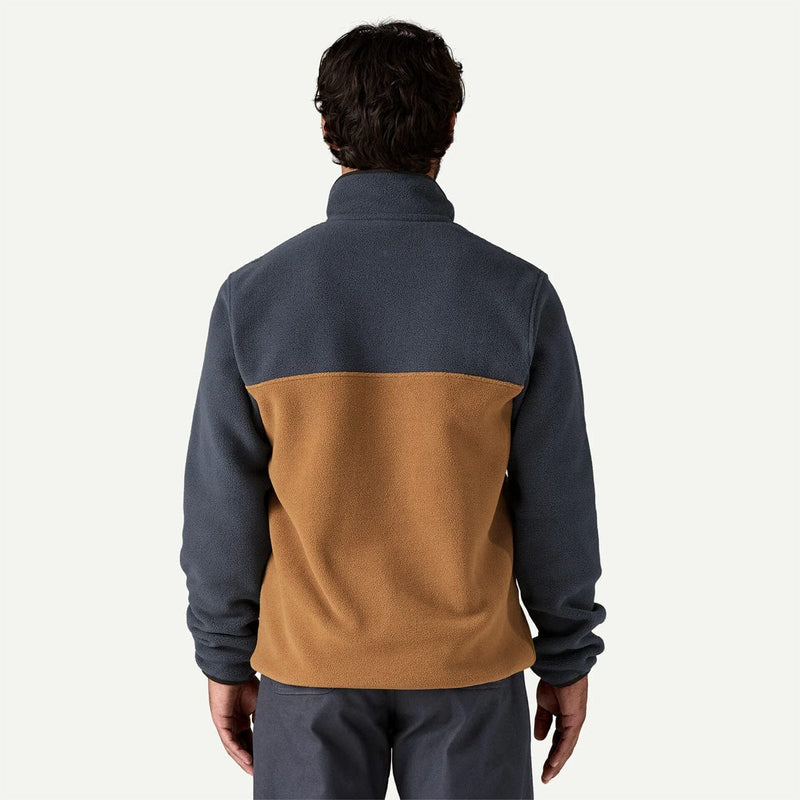 Load image into Gallery viewer, Person wearing a two-tone fleece jacket with dark gray and brown colors on a white background
