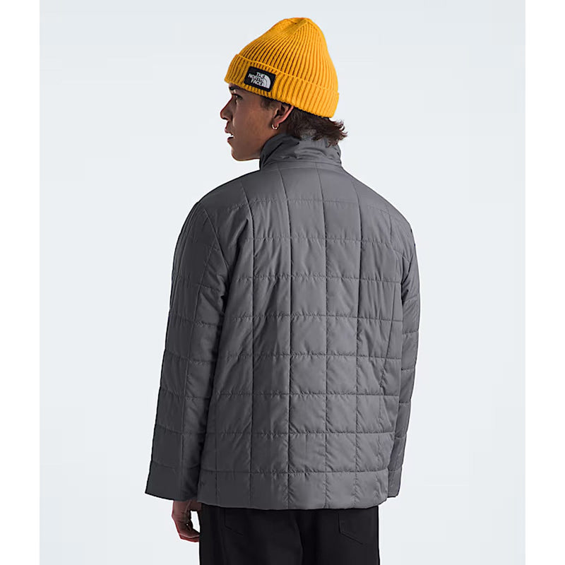 Load image into Gallery viewer, Person wearing a gray quilted jacket and yellow beanie on a white background
