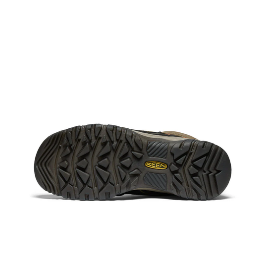 Brown shoe with black sole on a white background