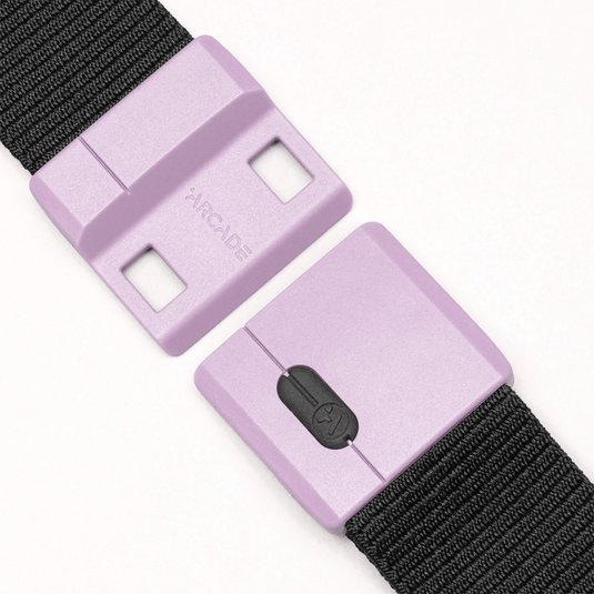 Pair of purple belt buckles with black straps on a white background