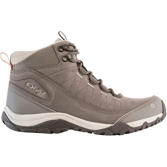 Gray hiking boot with white sole on a white background