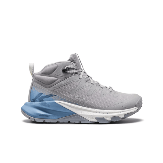 Gray athletic shoe with blue sole on a white background