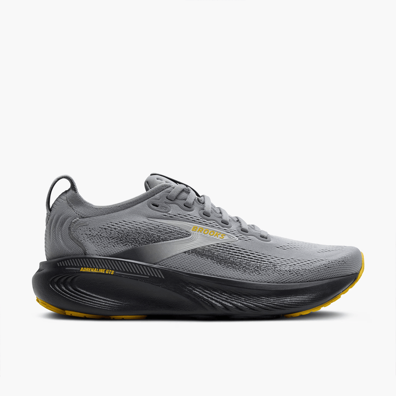 Load image into Gallery viewer, Gray running shoe with yellow accents on a white background
