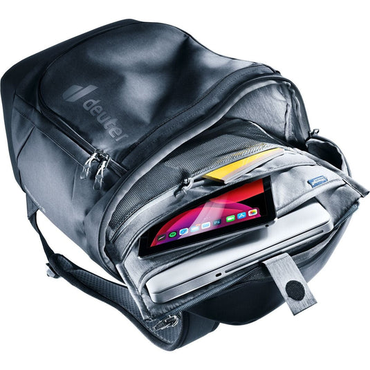 Gray backpack with a laptop and tablet inside, featuring the Deuter brand.