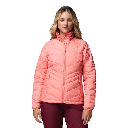Woman wearing a pink puffer jacket on a white background