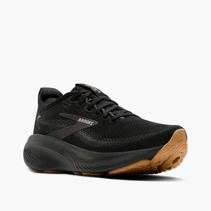 Load image into Gallery viewer, Black running shoe with brown sole on a white background
