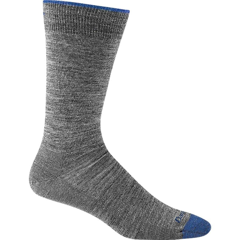 Load image into Gallery viewer, A pair of black Darn Tough crew socks designed for men, showing the side profile of the socks with the brand logo visible.
