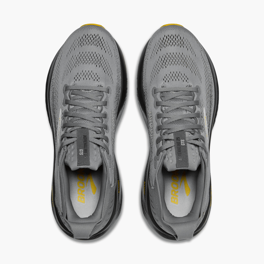 Gray running shoes with visible brand logo on a white background