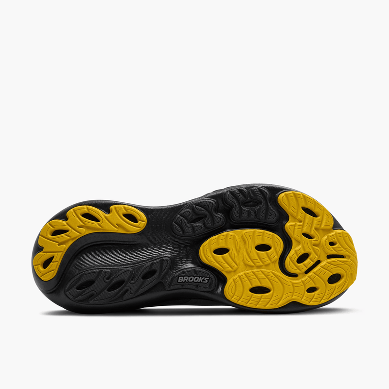 Load image into Gallery viewer, Black and yellow running shoe sole with 'Brooks' branding on a white background
